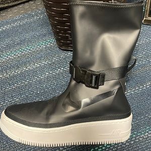 Woman’s Nike Air Force One Sage High. They are size 7 and black.